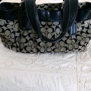 Grey and black coach purse